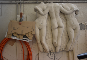 The photo is taken inside the Hondrogiannis workshop and it depicts the detail of the sculptural relief and sketches around it.